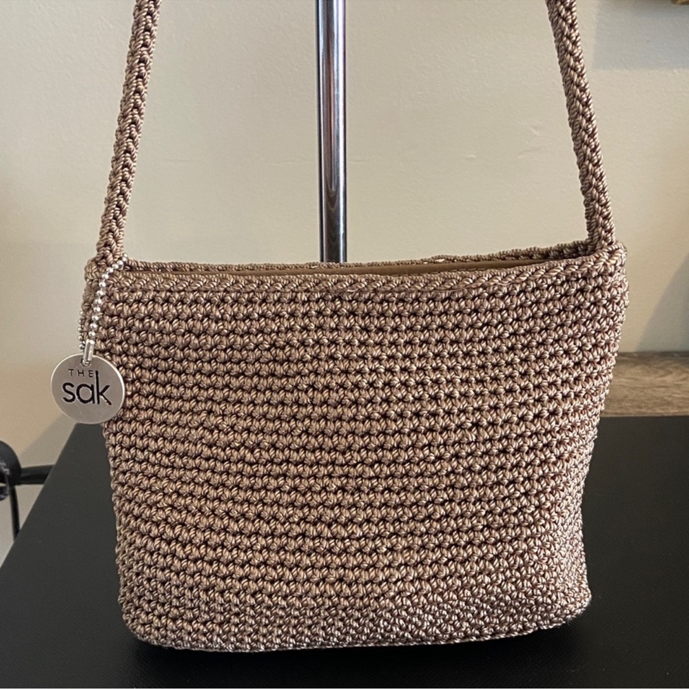 The Sak Metallic Taupe Crochet Shoulder Bag with Logo Charm